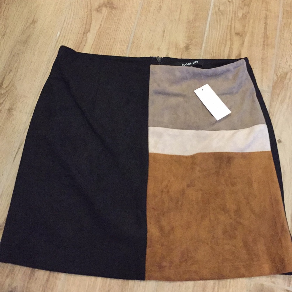 Never been worn. Brown, black and cream skirt.